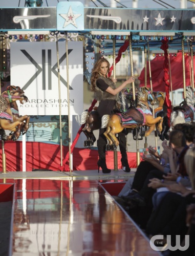 "LaToya Jackson" -- The women model fashions from the Kardashian Collection for a runway challenge at the Santa Monica Pier with Kim, Kourtney and Khloe Kardashian in attendance. The stakes are raised when the women find out they must exit a moving carousel before hitting the runway on America's Next Top Model on The CW.  pictured: Dominique Cycle 17 Photo: Mathieu Young/The CW ©2011 The CW Network, LLC. All Rights Reserved