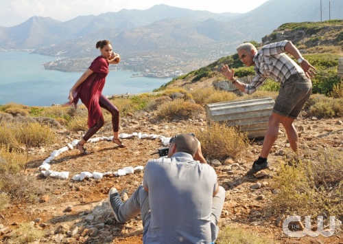 "Exploring Greece" -- Nigel Barker photographs the models re-creating ancient Olympic sports on America's Next Top Model on The CW.  pictured left to right: Angelea, Nigel Barker (seated) and Jay Manuel Cycle 17 Photo: Walter Sassard/The CW ©2011 The CW Network, LLC. All Rights Reserved
