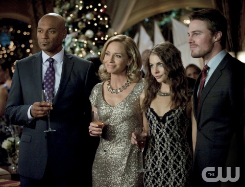 Arrow -- "Year's End" -- Image AR109b_0208b -- Pictured (L-R): Colin Salmon as Walter, Susanna Thompson as Moira, Willa Holland as Thea, and Stephen Amell as Arrow -- Photo: Cate Cameron/The CW -- ©2012 The CW Network. All Rights Reserved